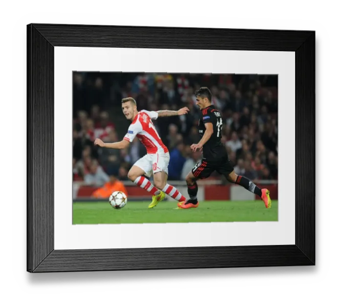 Framed Print : Arsenal's Jack Wilshere Clashes with Besiktas Mustafa Pektemek in UEFA Champions League Qualifier