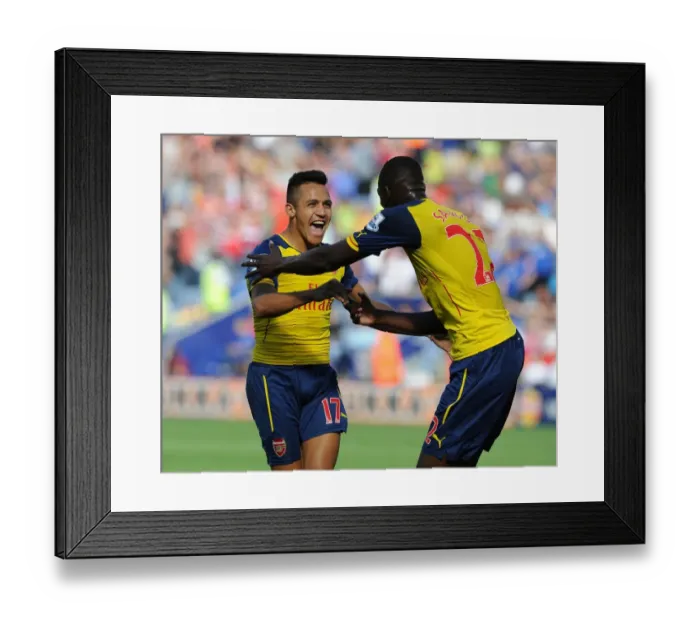 Framed Print : Arsenal's Deadly Duo: Sanchez and Sanogo Celebrate Goal Against Leicester City (2014-15) Framed Print : Arsenal's Deadly Duo: Sanchez and Sanogo Celebrate Goal Against Leicester City (2014-15)