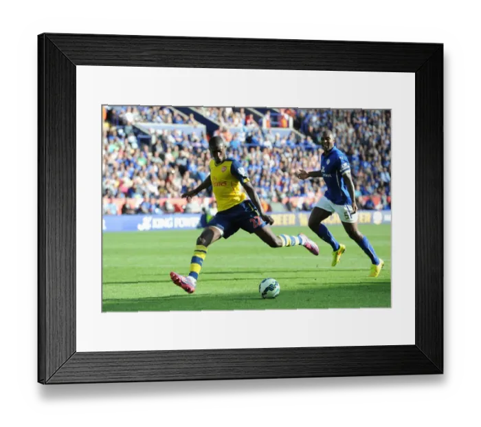 Framed Print : Yaya Sanogo (Arsenal) Wes Morgan (Leicester). Leicester City 1: 1 Arsenal. Barclays Premier League Framed Print : Yaya Sanogo (Arsenal) Wes Morgan (Leicester). Leicester City 1: 1 Arsenal. Barclays Premier League