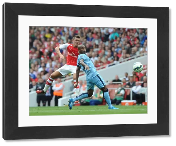 Mesut Ozil (Arsenal) Fernadinho (Man City). Arsenal 2: 2 Manchester City. Barclays Premier League