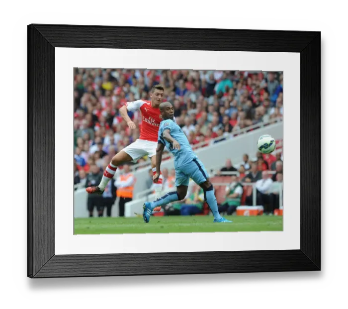 Framed Print : Mesut Ozil (Arsenal) Fernadinho (Man City). Arsenal 2: 2 Manchester City. Barclays Premier League Framed Print : Mesut Ozil (Arsenal) Fernadinho (Man City). Arsenal 2: 2 Manchester City. Barclays Premier League