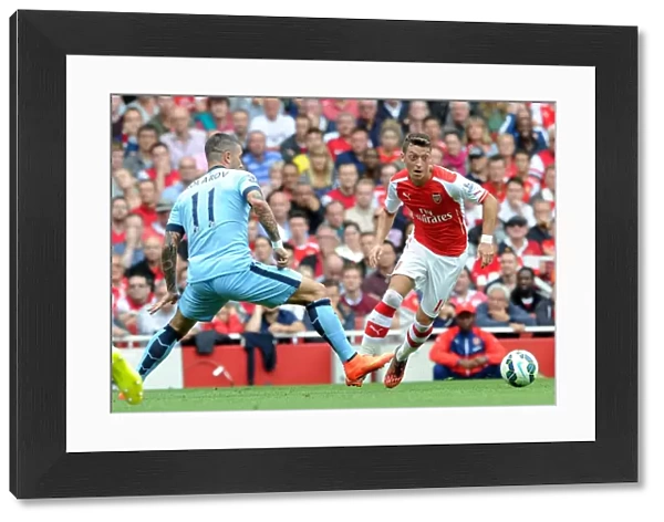 Mesut Ozil (Arsenal) Alexander Kolarov (Man City). Arsenal 2: 2 Manchester City. Barclays
