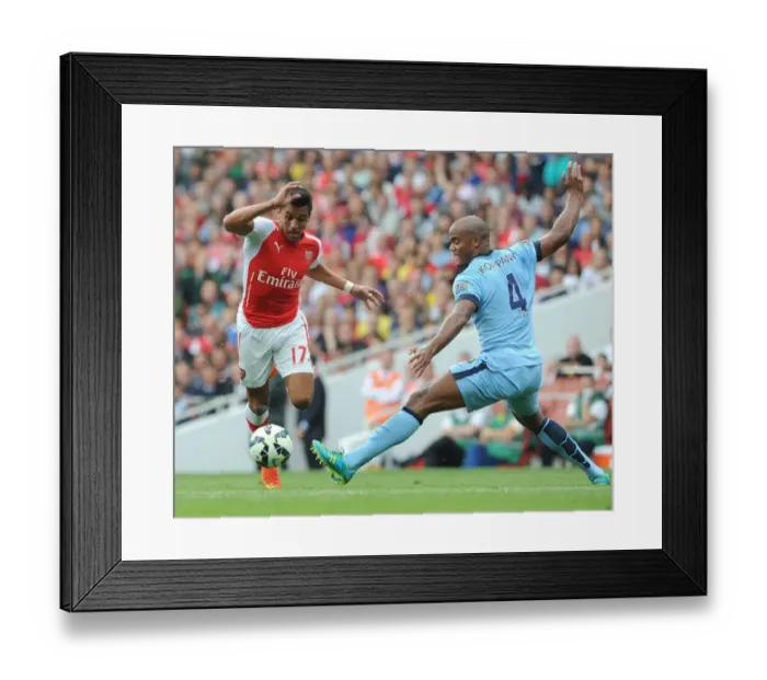 Framed Print : Arsenal's Alexis Sanchez Outmaneuvers Manchester City's Vincent Kompany
