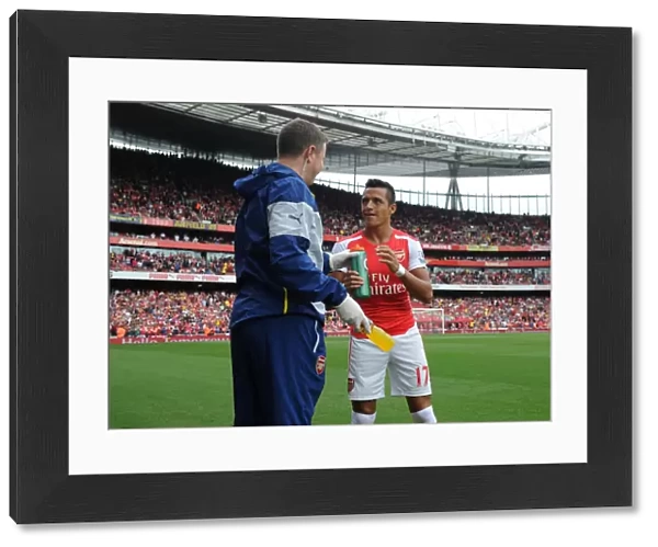 Alexis Sanchez (Arsenal) with Arsenal Physio Colin Lewin before the match. Arsenal 2