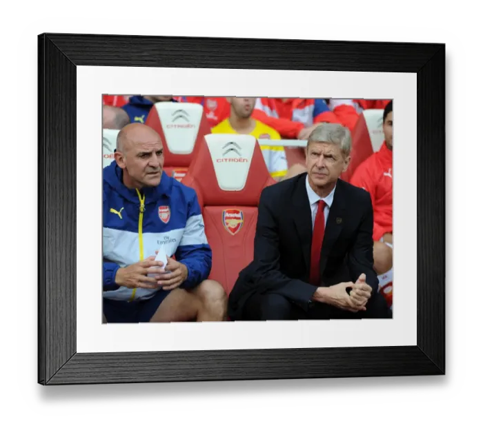 Framed Print : Arsene Wenger and Steve Bould: Pre-Match Huddle at Arsenal's Emirates Stadium (Arsenal v Manchester City, 2014-15)