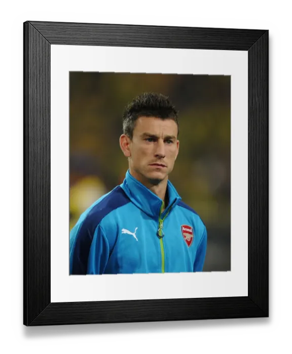 Framed Print : Laurent Koscielny: Arsenal's Fortitude Before Borussia Dortmund in the UEFA Champions League (2014-15) Framed Print : Laurent Koscielny: Arsenal's Fortitude Before Borussia Dortmund in the UEFA Champions League (2014-15)