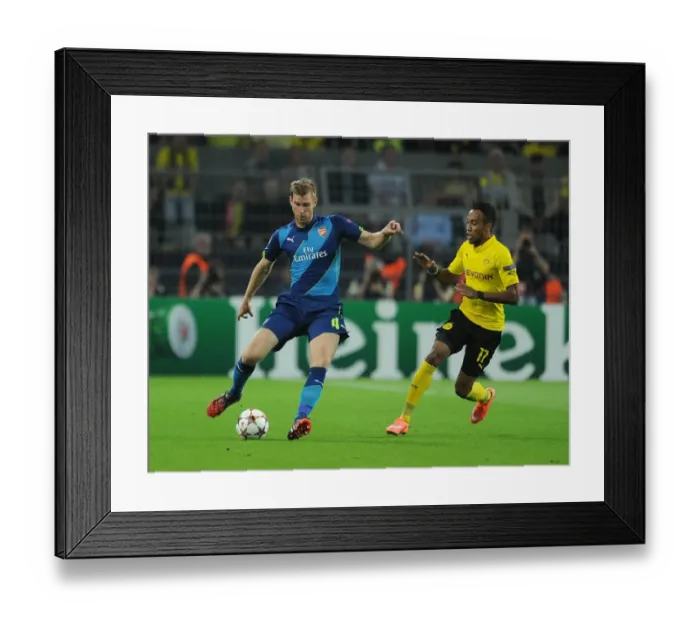 Framed Print : Clash of Stars: Per Mertesacker vs. Pierre-Emerick Aubameyang - Borussia Dortmund vs. Arsenal, UEFA Champions League Framed Print : Clash of Stars: Per Mertesacker vs. Pierre-Emerick Aubameyang - Borussia Dortmund vs. Arsenal, UEFA Champions League