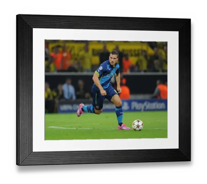 Framed Print : Lukas Podolski: Battle of the Former Dortmund Stars - Borussia Dortmund vs Arsenal, UEFA Champions League 2014-15
