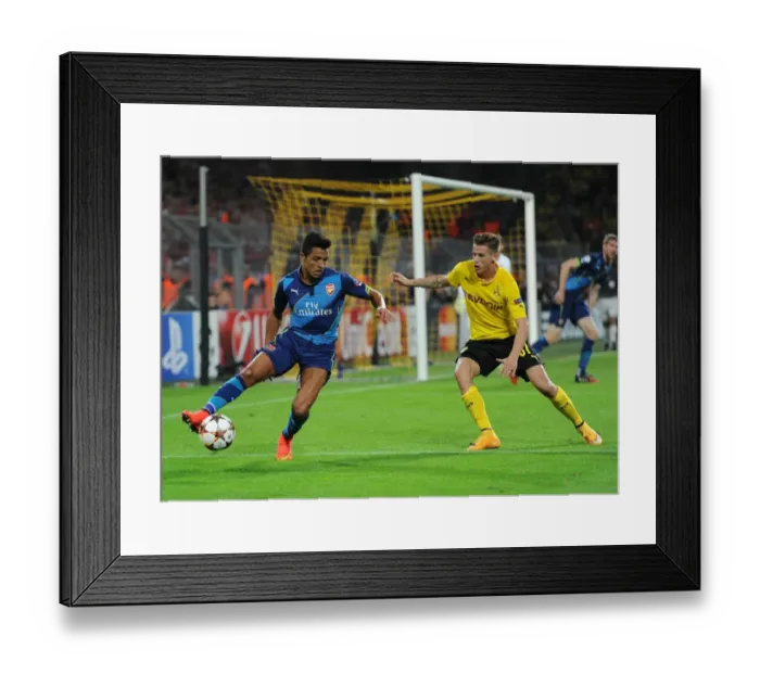 Framed Print : Clash of Stars: Sanchez vs. Durm - Borussia Dortmund vs. Arsenal, UEFA Champions League