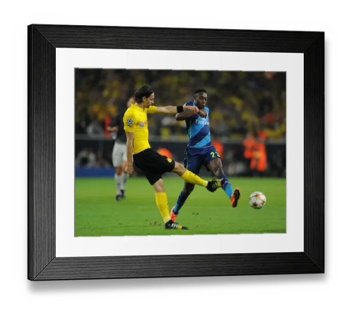 Framed Print : Danny Welbeck vs. Neven Subotic: Intense Battle in Borussia Dortmund vs. Arsenal UEFA Champions League Clash