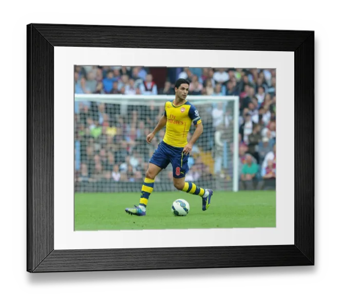 Framed Print : Mikel Arteta Leads Arsenal Against Aston Villa in Premier League (2014-15) Framed Print : Mikel Arteta Leads Arsenal Against Aston Villa in Premier League (2014-15)