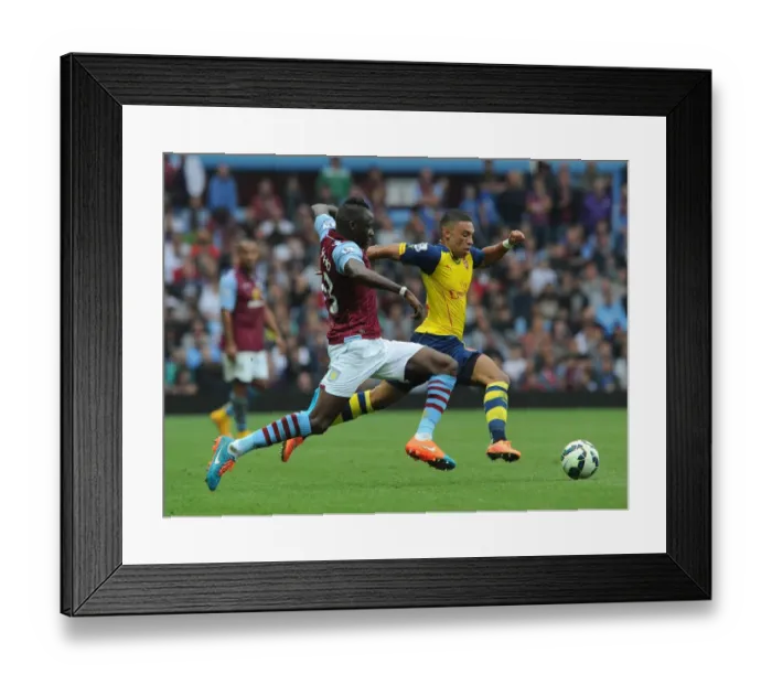 Framed Print : Alex Oxlade-Chamberlain Outmaneuvers Aly Cissokho in Aston Villa vs Arsenal Premier League Clash Framed Print : Alex Oxlade-Chamberlain Outmaneuvers Aly Cissokho in Aston Villa vs Arsenal Premier League Clash