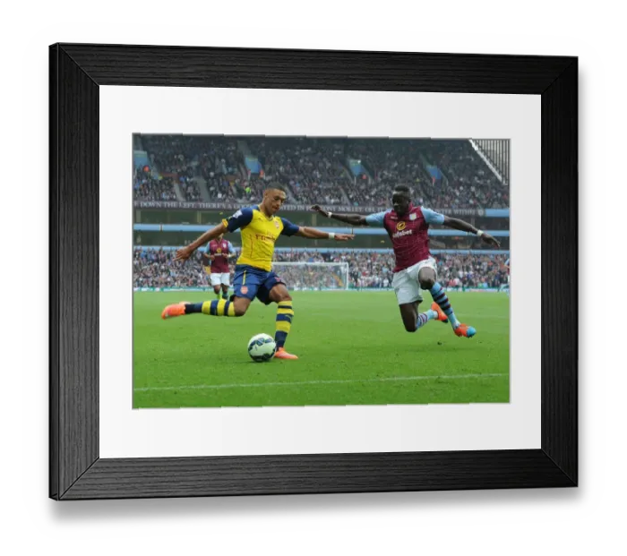 Framed Print : Arsenal's Alex Oxlade-Chamberlain Faces Off Against Aly Cissokho in Premier League Clash Framed Print : Arsenal's Alex Oxlade-Chamberlain Faces Off Against Aly Cissokho in Premier League Clash