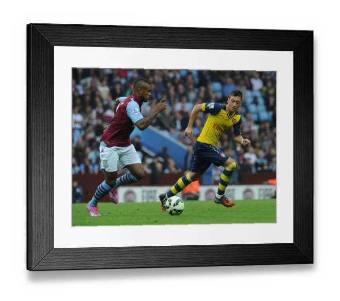 Framed Print : Mesut Ozil Closes In on Leandro Bacuna: Aston Villa vs Arsenal, Premier League 2014-15 Framed Print : Mesut Ozil Closes In on Leandro Bacuna: Aston Villa vs Arsenal, Premier League 2014-15