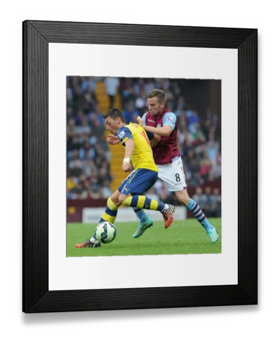 Framed Print : Mesut Ozil vs. Tom Cleverley: Clash at Villa Park, 2014-15 Premier League