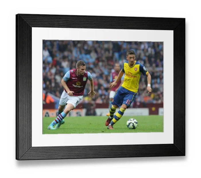 Framed Print : Mesut Ozil vs Tom Cleverley: A Football Battle at Villa Park, 2014-15 Premier League Framed Print : Mesut Ozil vs Tom Cleverley: A Football Battle at Villa Park, 2014-15 Premier League