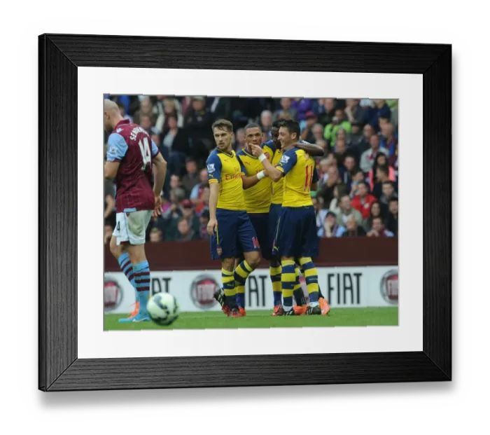 Framed Print : Mesut Ozil's Strike: Arsenal's Winning Moment Against Aston Villa (2014-15) Framed Print : Mesut Ozil's Strike: Arsenal's Winning Moment Against Aston Villa (2014-15)