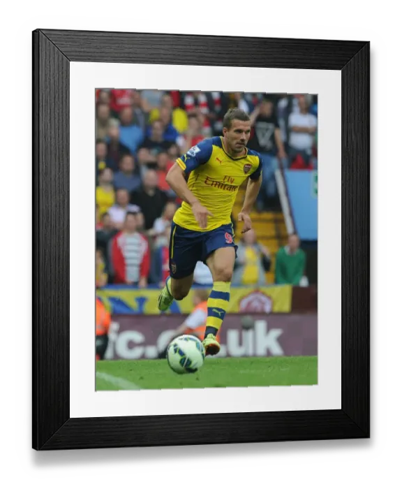 Framed Print : Lukas Podolski: Arsenal's Star Performer at Aston Villa, September 2014