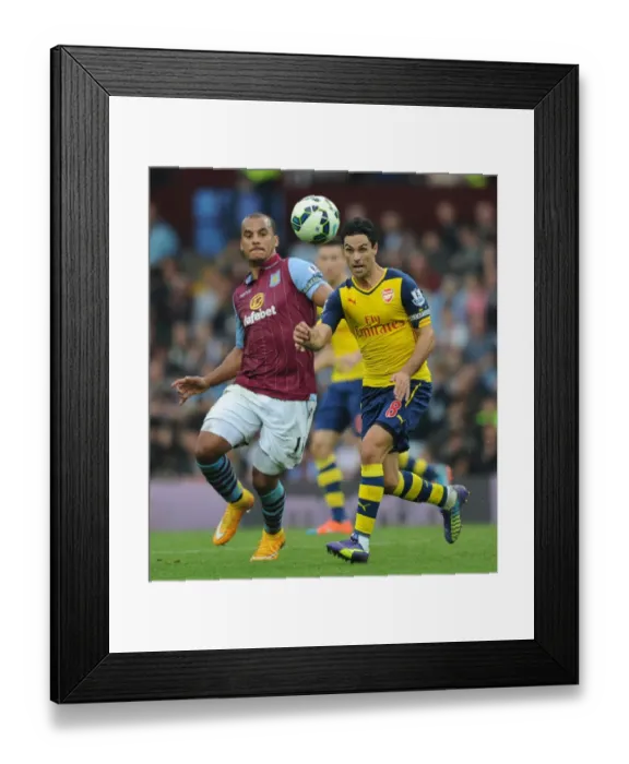 Framed Print : Mikel Arteta vs. Gabby Agbonlahor: Intense Battle in Aston Villa vs. Arsenal Premier League Clash