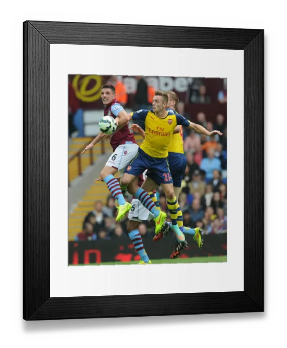 Framed Print : Chambers vs. Clark: Intense Battle in Aston Villa vs. Arsenal Premier League Clash Framed Print : Chambers vs. Clark: Intense Battle in Aston Villa vs. Arsenal Premier League Clash
