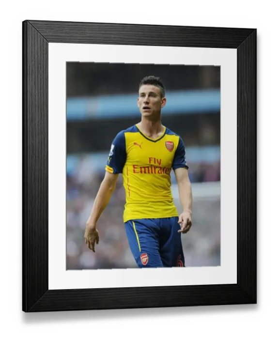 Framed Print : Laurent Koscielny Focuses in Aston Villa vs Arsenal Premier League Clash (2014-15) Framed Print : Laurent Koscielny Focuses in Aston Villa vs Arsenal Premier League Clash (2014-15)