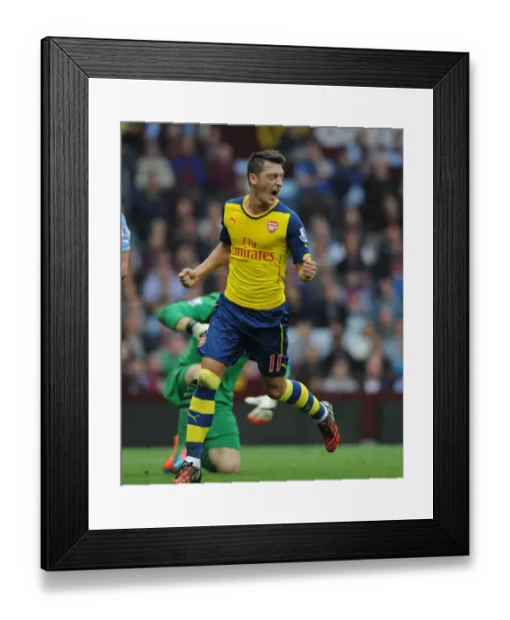 Framed Print : Mesut Ozil's Signature Moment: Scoring First for Arsenal Against Aston Villa in the Premier League 2014-15 Framed Print : Mesut Ozil's Signature Moment: Scoring First for Arsenal Against Aston Villa in the Premier League 2014-15
