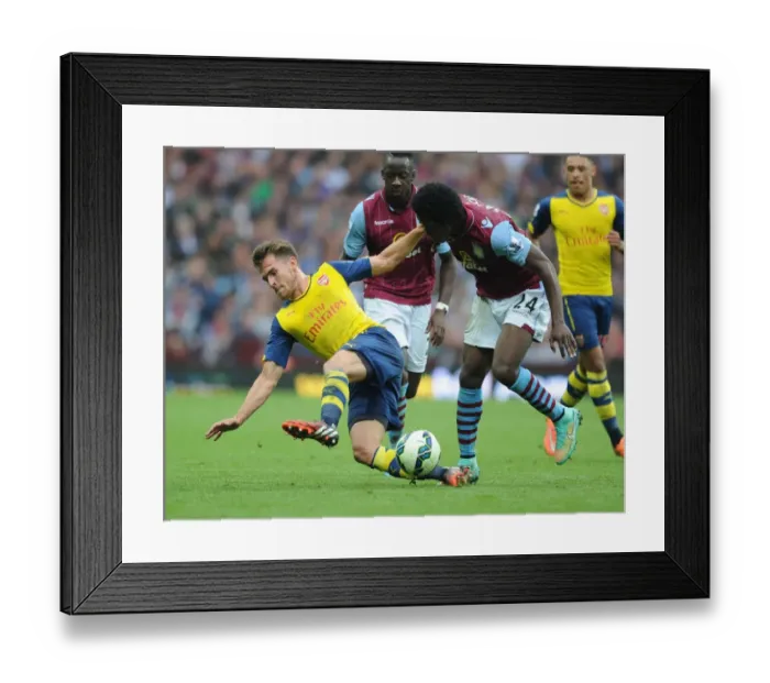Framed Print : Aaron Ramsey vs. Carlos Sanchez: Intense Battle in Aston Villa vs. Arsenal Premier League Clash