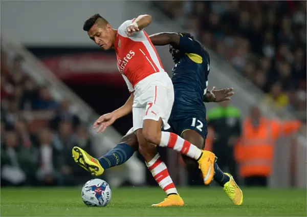 Sanchez vs. Wanyama: A League Cup Battle at the Emirates