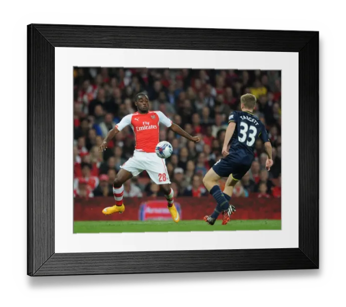 Framed Print : Arsenal's Joel Campbell Fends Off Southampton's Matt Targett in Capital One Cup Clash Framed Print : Arsenal's Joel Campbell Fends Off Southampton's Matt Targett in Capital One Cup Clash