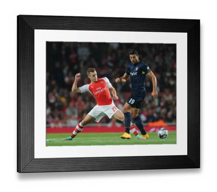 Framed Print : Clash at the Emirates: Chambers vs. Pelle in the League Cup Battle