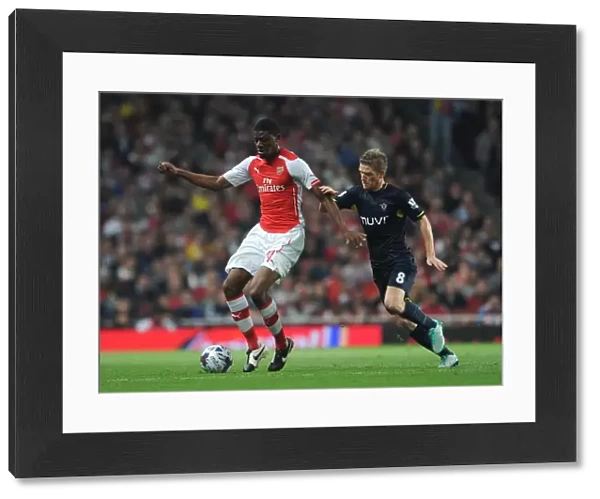 Abou Diaby vs. Steven Davis: Battle in the Capital One Cup between Arsenal and Southampton