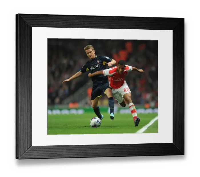 Framed Print : Arsenal vs Southampton: Tense Battle - Hayden vs Davis (Capital One Cup 2014 / 15)