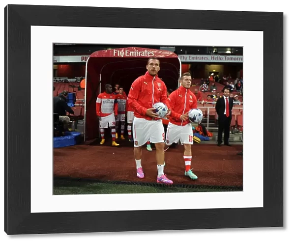 Arsenal's Podolski and Wilshere Prepare for Arsenal v Southampton in League Cup Showdown