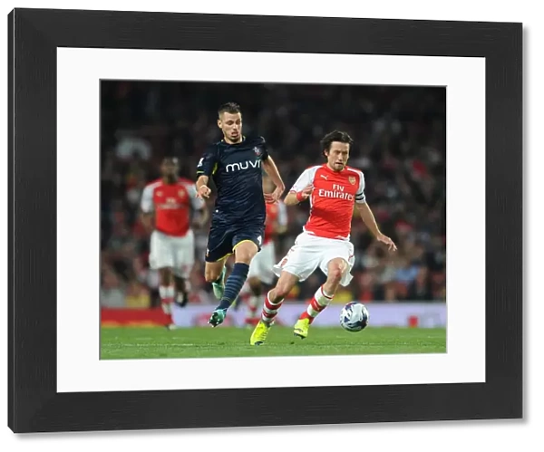 Arsenal's Rosicky Faces Off Against Southampton's Schneiderlin in League Cup Clash