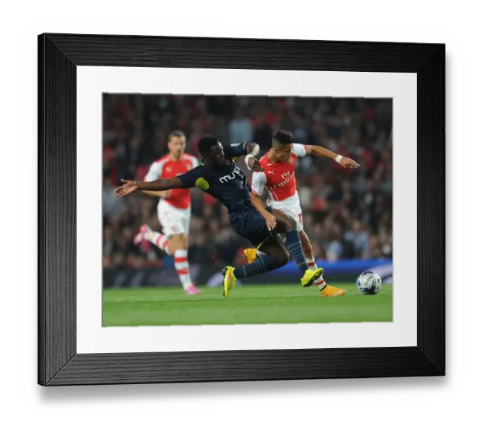 Framed Print : Sanchez vs. Wanyama: A Footballing Battle in Arsenal's League Cup Showdown
