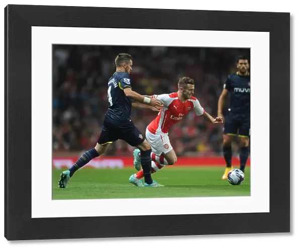 Arsenal's Jack Wilshere Faces Off Against Southampton's Morgan Schneiderlen in League Cup Clash