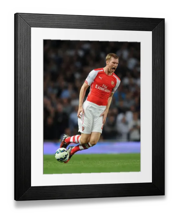 Framed Print : Per Mertesacker in Action: Arsenal vs. Tottenham Premier League Clash (2014-15) Framed Print : Per Mertesacker in Action: Arsenal vs. Tottenham Premier League Clash (2014-15)