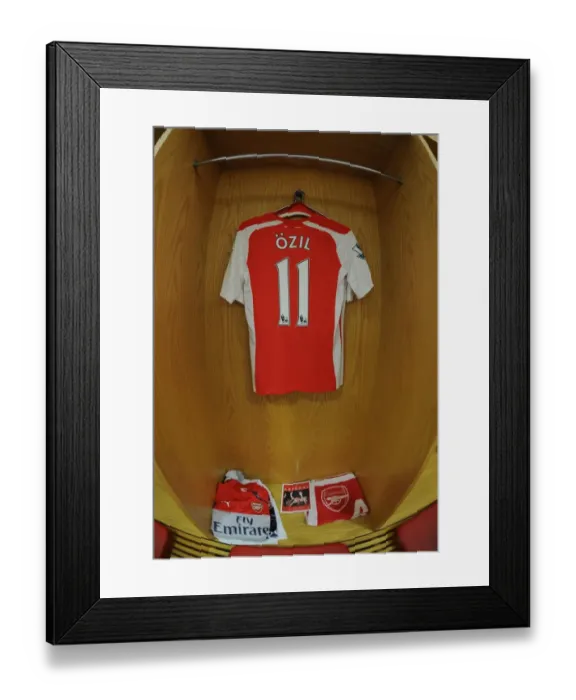 Framed Print : Mesut Ozil: Gearing Up for Battle - Arsenal Changeroom, 2014-15 Premier League