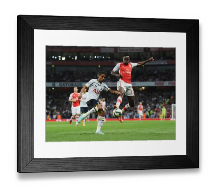 Framed Print : Clash at the Emirates: Welbeck vs. Naughton in the Arsenal-Tottenham Rivalry
