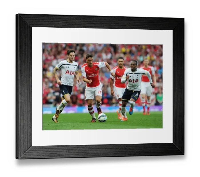 Framed Print : Mesut Ozil Breaks Past Danny Rose: Intense Rivalry - Arsenal vs. Tottenham, Premier League 2014-15