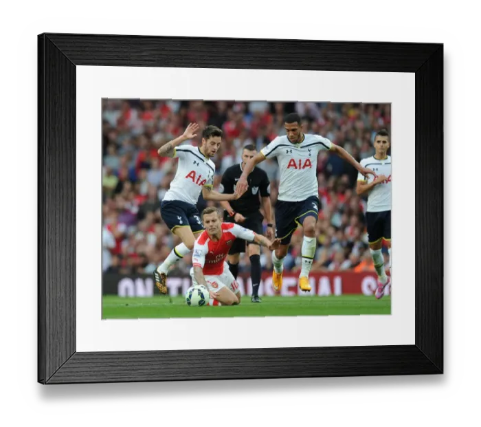Framed Print : Arsenal vs. Tottenham: Wilshere Tripped by Mason and Capoue in Intense Premier League Clash