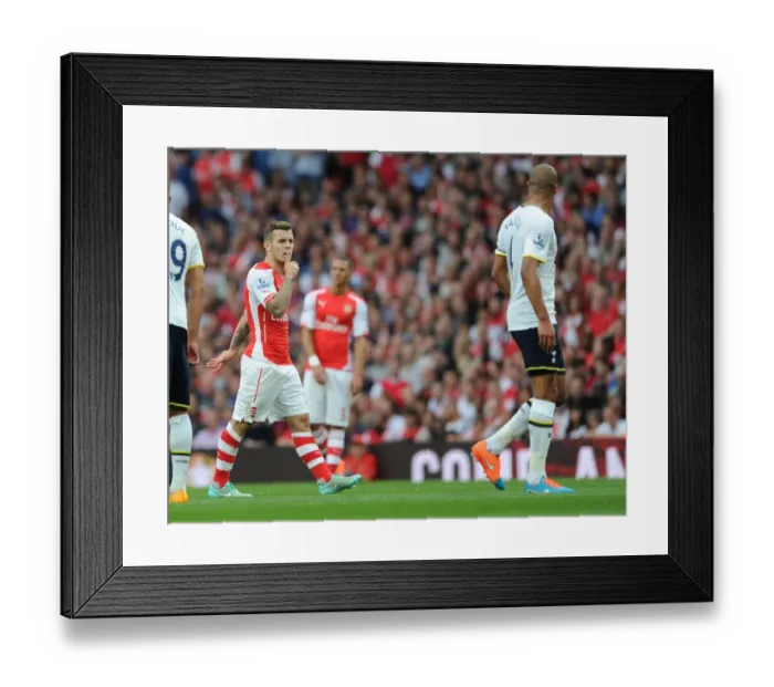Framed Print : Arsenal's Jack Wilshere and Tottenham's Younes Kaboul Lock Eyes During Intense Rivalry
