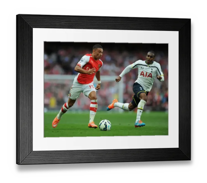 Framed Print : Arsenal's Alex Oxlade-Chamberlain Surges Past Tottenham's Danny Rose