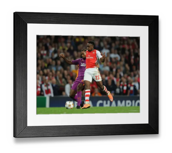 Framed Print : Arsenal's Danny Welbeck Scores Past Galatasaray's Aurelien Chedjou in 2014 / 15 Champions League Match Framed Print : Arsenal's Danny Welbeck Scores Past Galatasaray's Aurelien Chedjou in 2014 / 15 Champions League Match