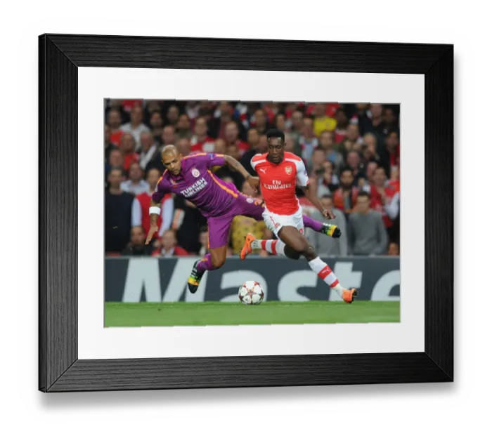 Framed Print : Danny Welbeck's Brilliant Outmaneuver of Felipe Melo: Arsenal's Thrilling Champions League Victory Framed Print : Danny Welbeck's Brilliant Outmaneuver of Felipe Melo: Arsenal's Thrilling Champions League Victory