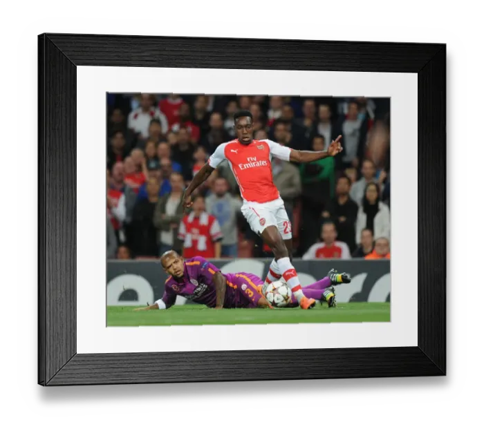 Framed Print : Arsenal's Danny Welbeck Outwits Felipe Melo in Electrifying Champions League Clash