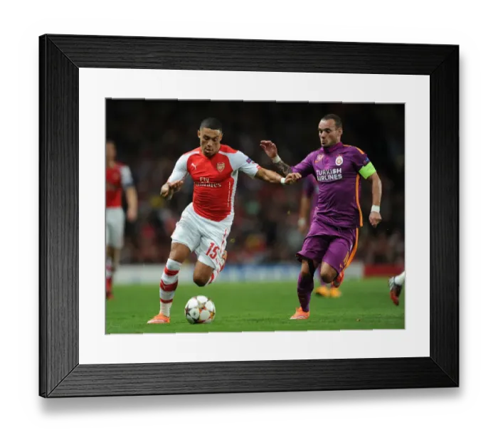 Framed Print : Arsenal vs. Galatasaray: Oxlade-Chamberlain vs. Sneijder in Champions League Clash Framed Print : Arsenal vs. Galatasaray: Oxlade-Chamberlain vs. Sneijder in Champions League Clash