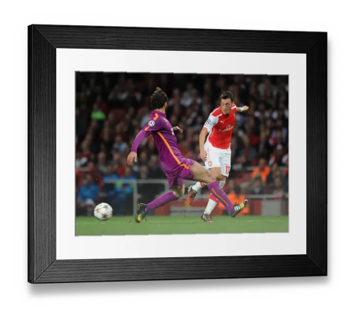 Framed Print : Mesut Ozil vs Hamit Altintop: Intense Battle in Arsenal's Champions League Clash with Galatasaray Framed Print : Mesut Ozil vs Hamit Altintop: Intense Battle in Arsenal's Champions League Clash with Galatasaray