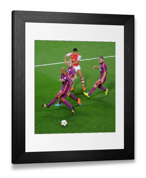 Framed Print : Arsenal's Alexis Sanchez Takes On Galatasaray's Defense in 2014 Champions League Clash Framed Print : Arsenal's Alexis Sanchez Takes On Galatasaray's Defense in 2014 Champions League Clash