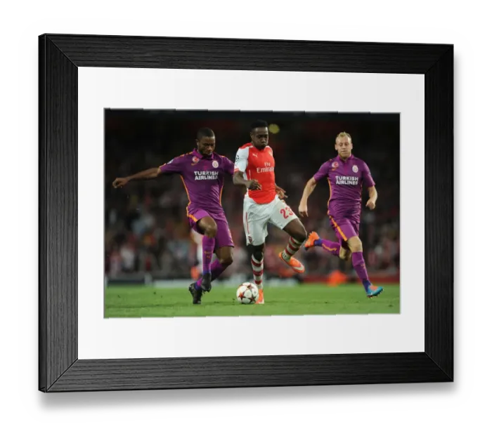 Framed Print : Arsenal's Danny Welbeck Clashes with Galatasaray's Aurelien Chedjou and Semih Kaya in Champions League Showdown Framed Print : Arsenal's Danny Welbeck Clashes with Galatasaray's Aurelien Chedjou and Semih Kaya in Champions League Showdown